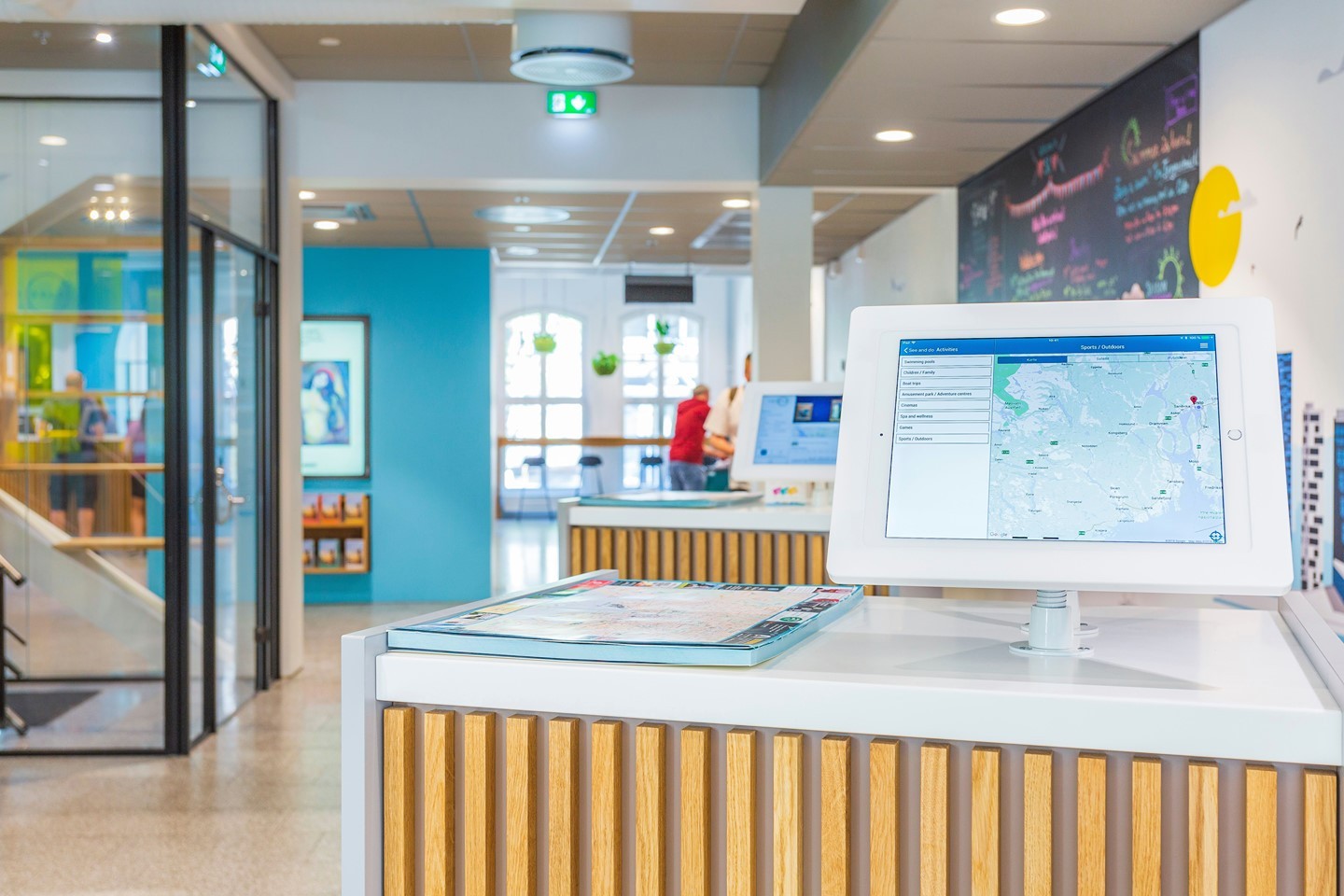 Interactive tablet kiosk displaying map in lobby