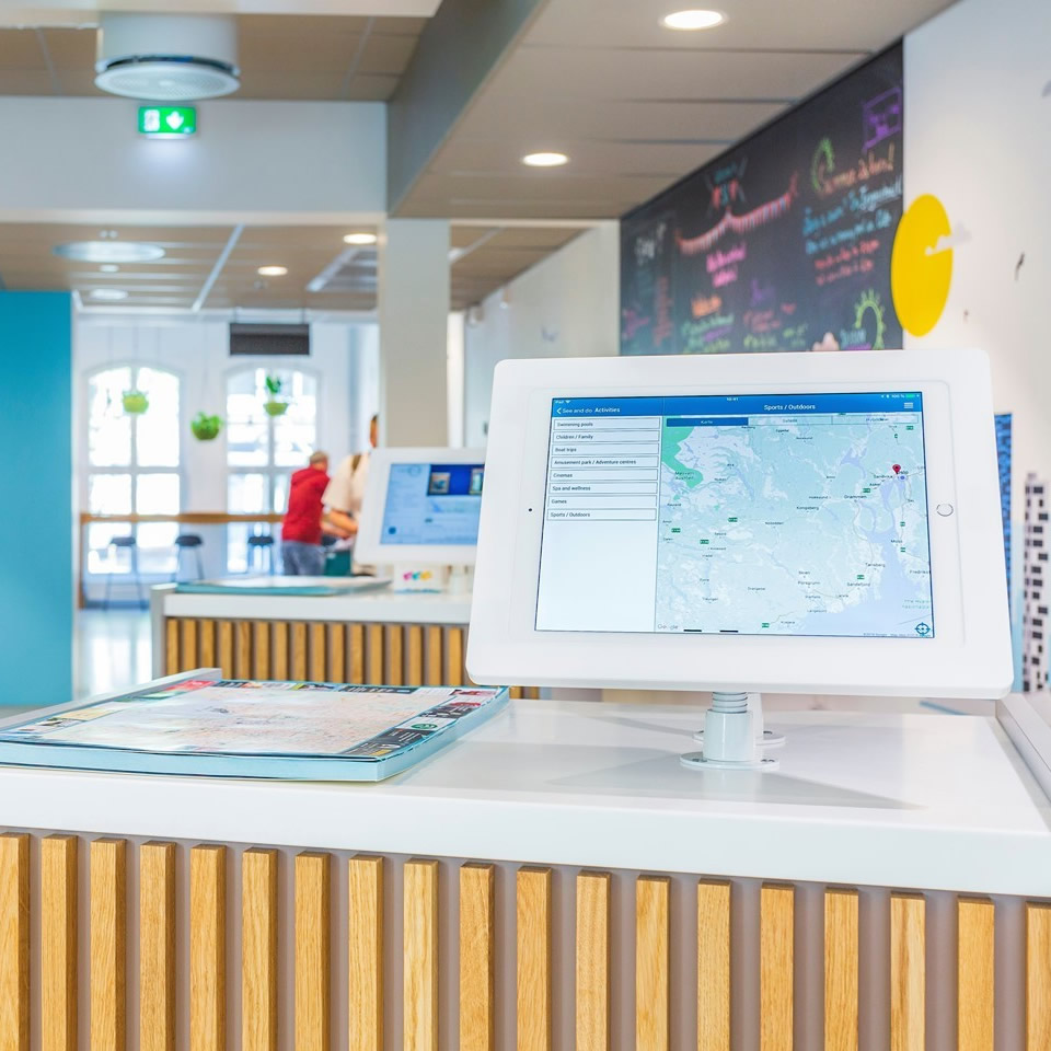 Desk mounted iPad in white enclosure