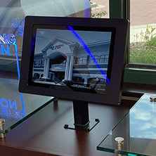 modern workstation with tablet, phone, and charging station displayed