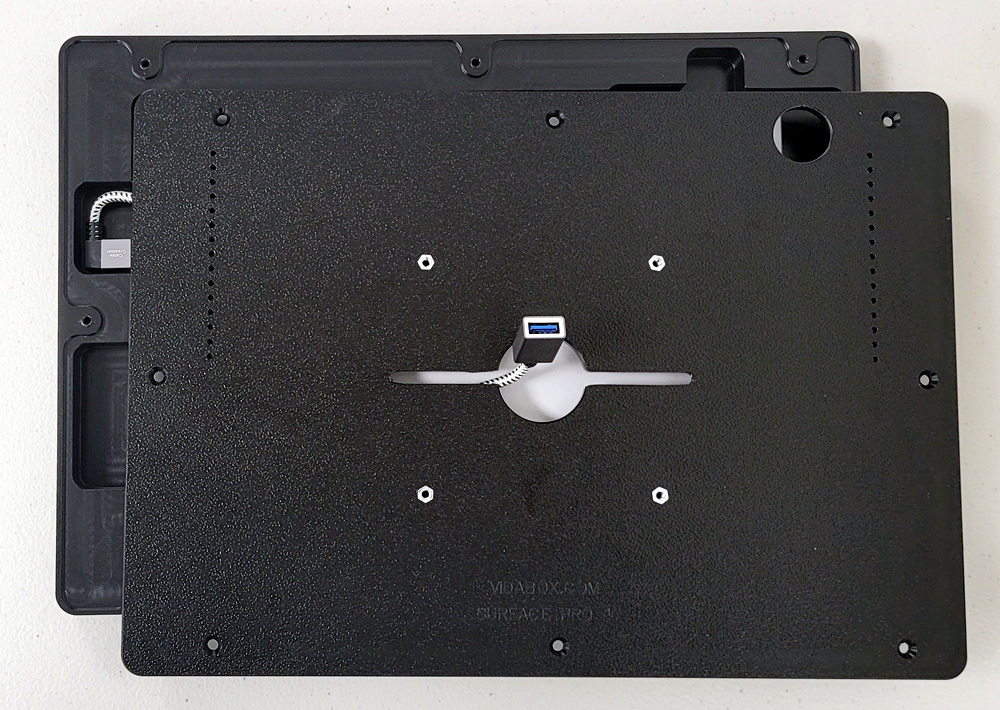 rear view of black VESA mount with a USB cable attached