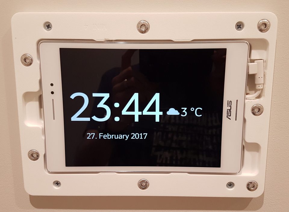 Wall-mounted ASUS tablet showing time 23:44, date 27 February 2017, and temperature 3 degrees Celsius.